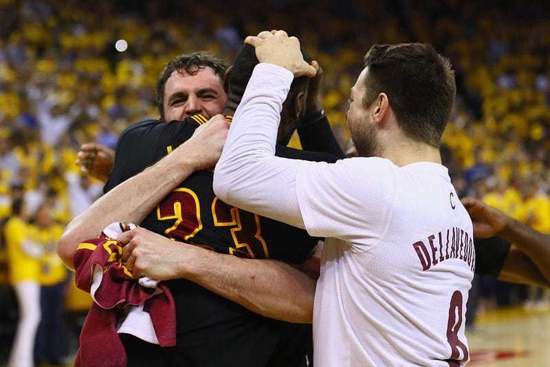 OAKLAND, CA - JUNE 19: LeBron James #23, Kevin Love #0, and Matthew Dellavedova #8 of the Cleveland Cavaliers celebrate after defeating the Golden State Warriors 93-89 in Game 7 of the 2016 NBA Finals at ORACLE Arena on June 19, 2016 in Oakland, Californi