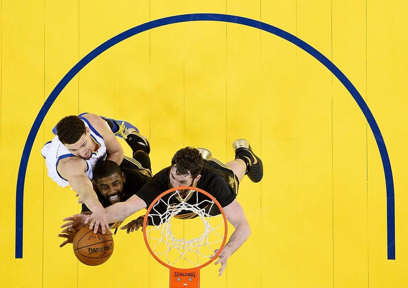 OAKLAND, CA - JUNE 19: Kyrie Irving #2 and Kevin Love #0 of the Cleveland Cavaliers go after the ball in front of Klay Thompson #11 of the Golden State Warriors in the second half in Game 7 of the 2016 NBA Finals at ORACLE Arena on June 19, 2016 in Oaklan