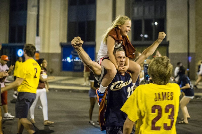 CLEVELAND, OH - JUNE 19: Cleveland Cavaliers fans celebrate in the street after the Cavaliers defeated the Golden State Warriors to win the NBA Championship on June 19, 2016 in Cleveland, Ohio. The victory brings the first professional sports championship