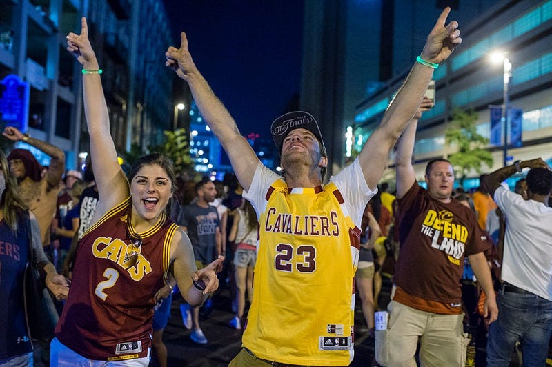 CLEVELAND, OH - JUNE 19: Cleveland Cavaliers fans celebrate in the street after the Cavaliers defeated the Golden State Warriors to win the NBA Championship on June 19, 2016 in Cleveland, Ohio. The victory brings the first professional sports championship