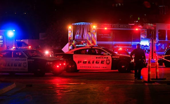 Dallas police work near the scene where eleven Dallas police officers were shot and five have now died on July 8, 2016 in Dallas, Texas. According to reports, shots were fired during a protest being held in downtown Dallas in response to recent fatal shoo