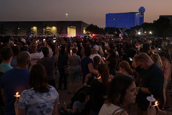 Hundreds of residents show support for the Dallas Police Department at the Dallas Strong Candlelight Vigil on July 11, 2016 in downtown Dallas, Texas. Texas. Five police officers were killed and seven others were injured in a shooting ambush during a marc