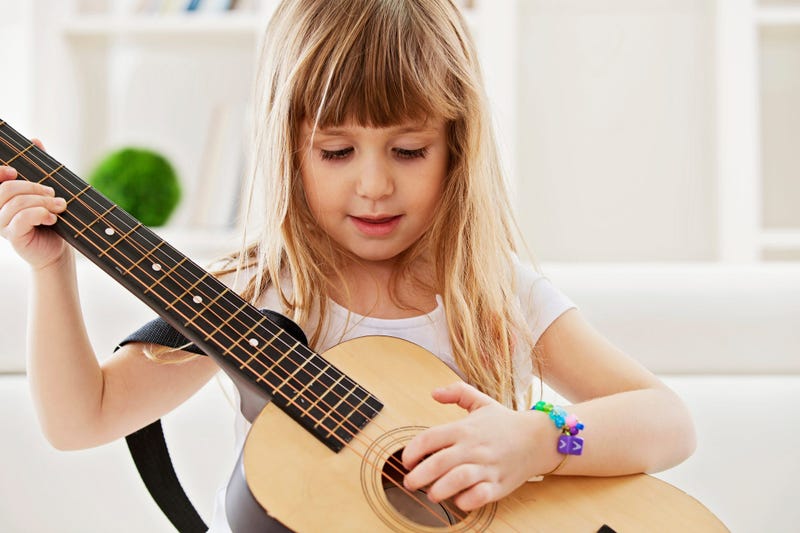 Child playing guitar