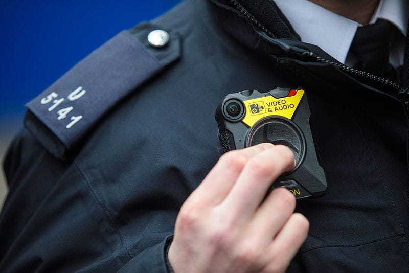 PC Green demonstrates switching on a body-worn camera (BWC) at Brixton Police Station on January 25, 2017 in London, England.