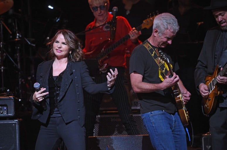 Patty Smyth (L) and John McEnroe perform onstage during"Love Rocks NYC! A Change is Gonna Come: Celebrating Songs of Peace, Love and Hope"