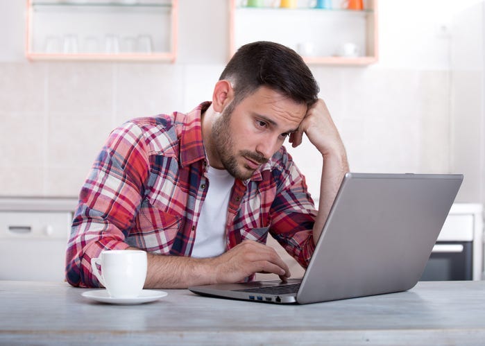 Sad Man at Computer