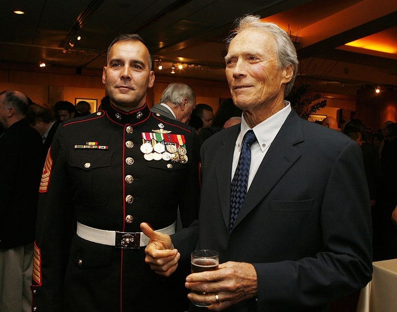 Military Technical Advisor Sgt. Major James Dever, USMC (Ret.) (L) and actor/director Clint Eastwood pose at the afterparty for the premiere of Paramount&apos;s 