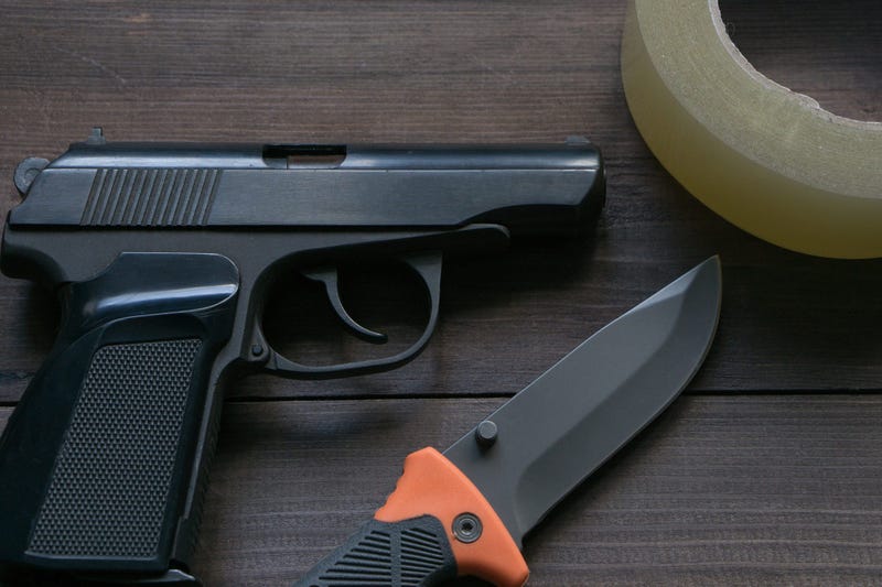 criminal news equipment. gun, knife, duct tape - stock photo