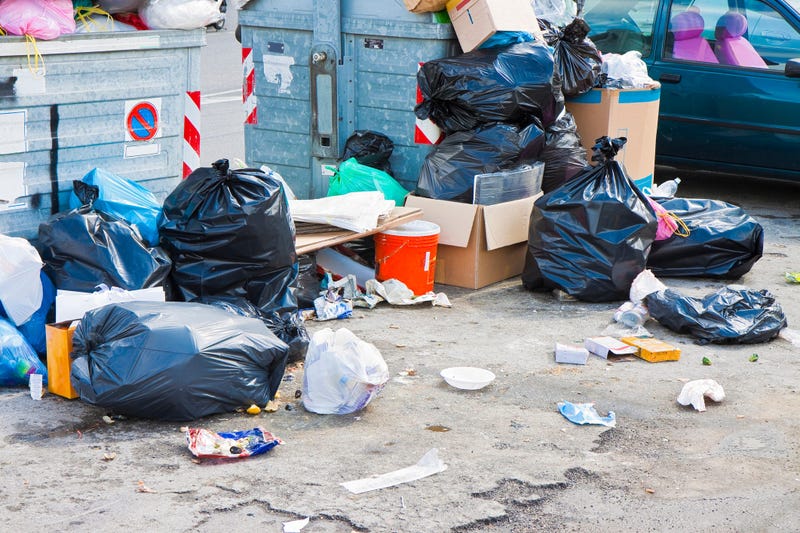 Garbage overflowing in a dumpster