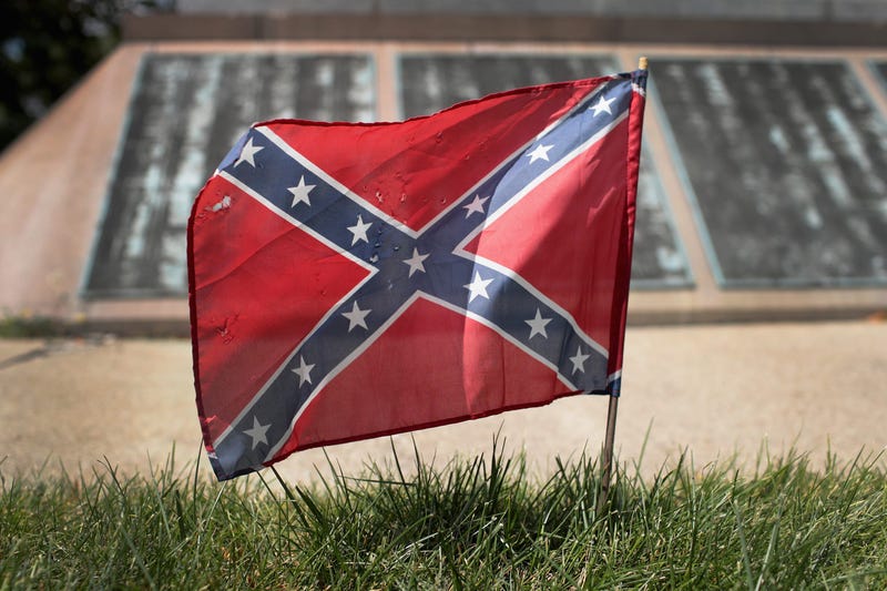 A Confederate Navy jack flag sits at the base of Confederate Mound, a memorial to more than 4,000 Confederate prisoners of war who died in captivity at Camp Douglas and are buried around the monument,