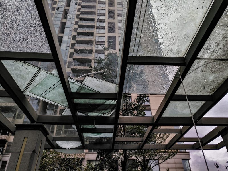 Broken glass in downtown building after severe weather