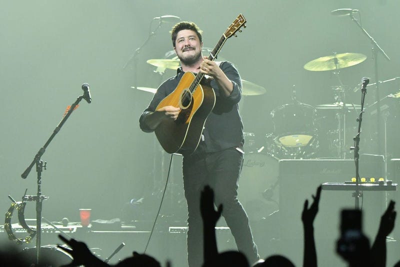 Marcus Mumford of Mumford & Sons on stage