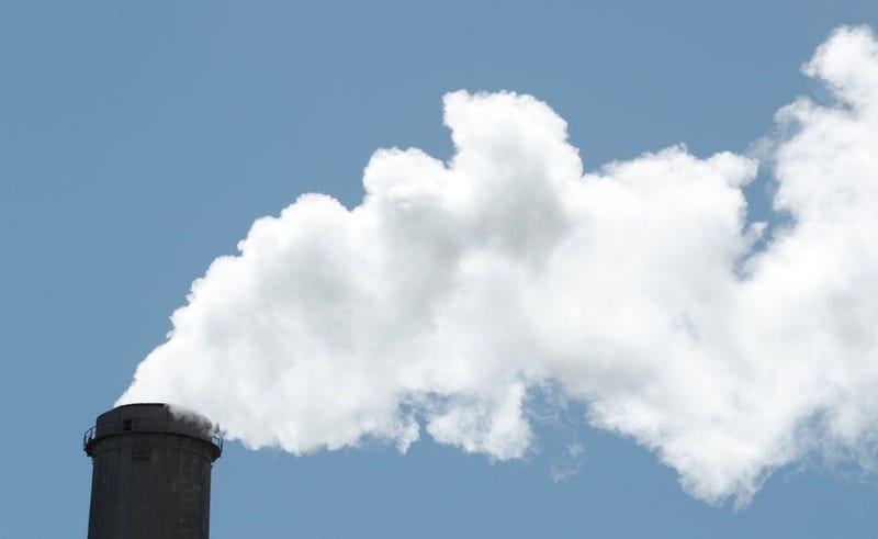 Emissions rise out of a large smoke stack at Pacificorp's 1000 megawatt coal fired power plant on October 9, 2017 outside Huntington, Utah.