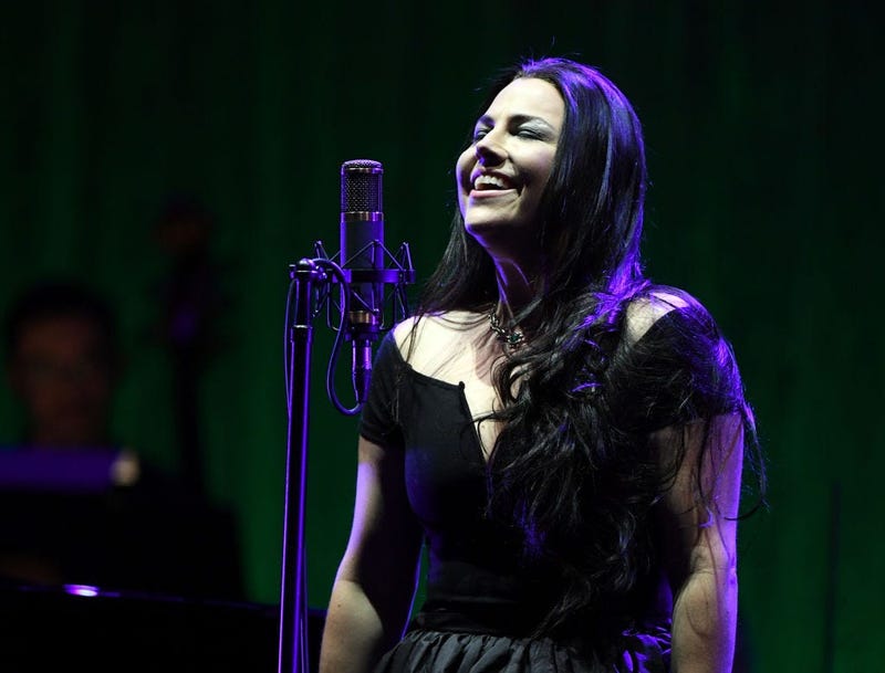 Amy Lee of Evanescence smiles while on stage