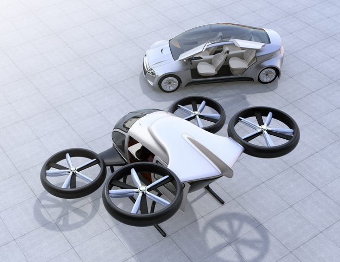 Rear view of self-driving car and passenger drone parking on the ground. 3D rendering image