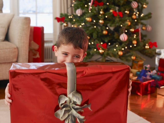 Boy holding Christmas gift