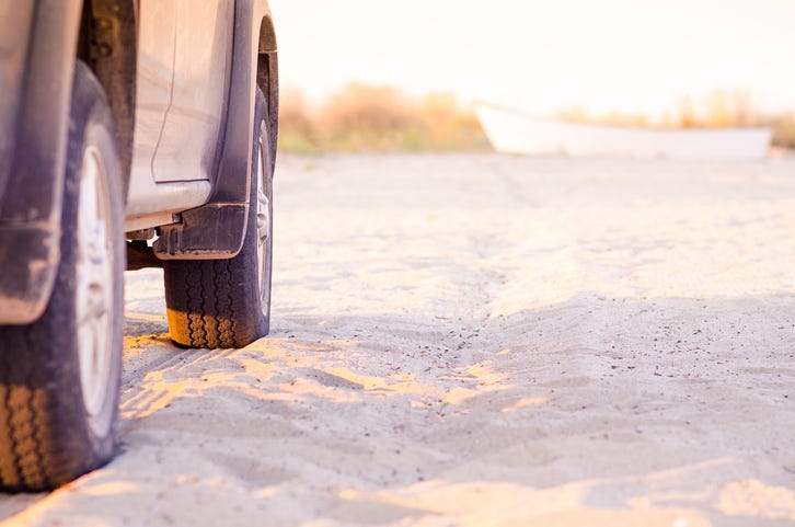 vehicle on the beach sand