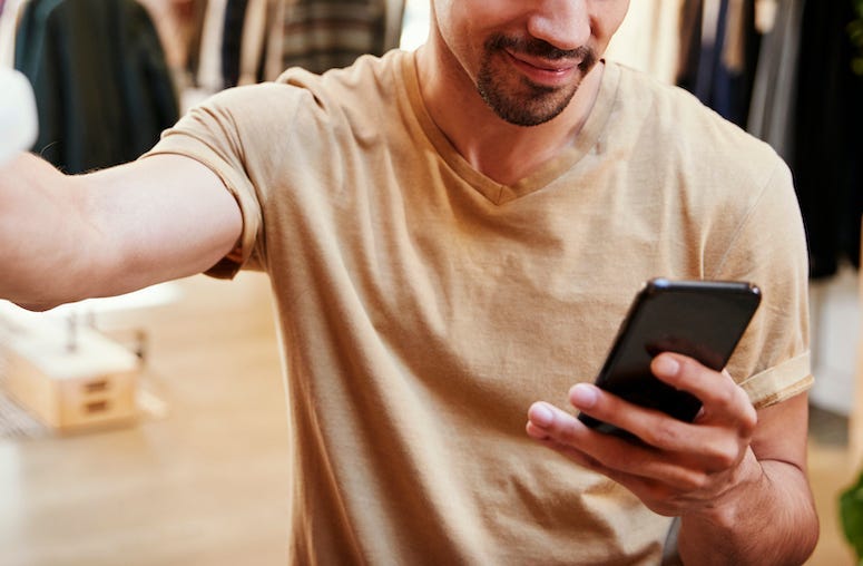 Man, Clothing Store, Texting, Phone, Smiling