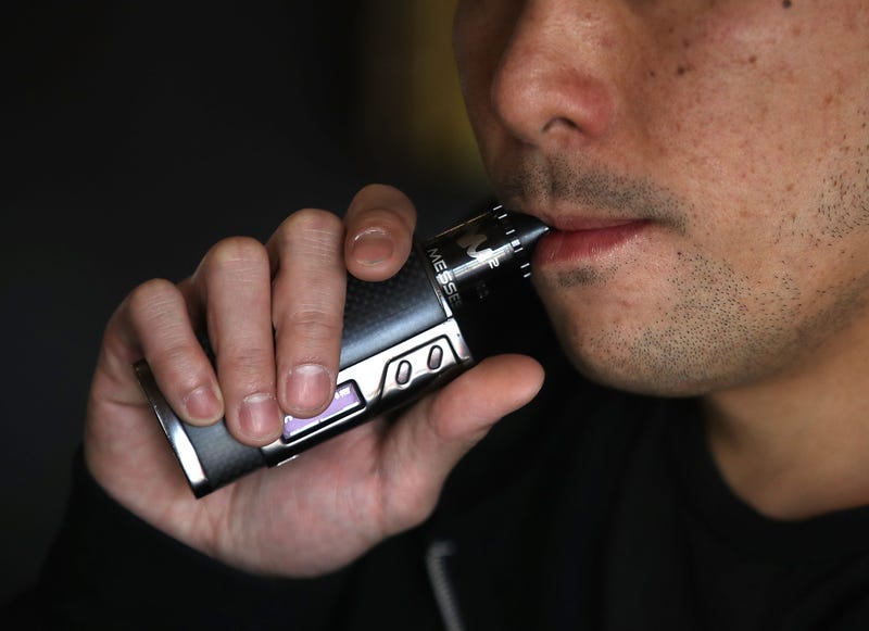 Man smokes an e-cigarette