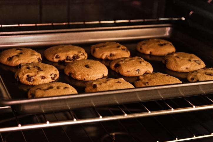 A dozen cookies baking in the oven