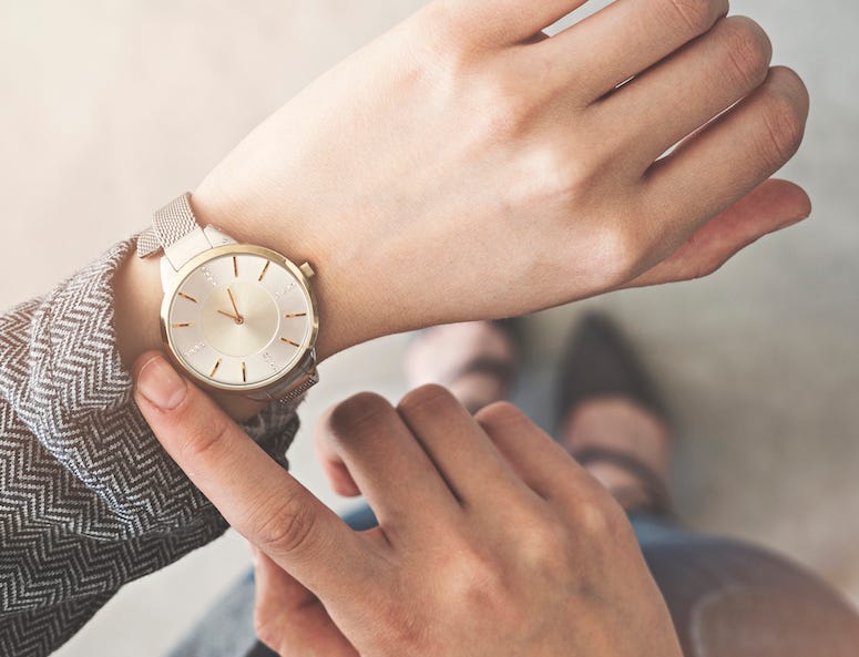 Woman Checking Watch, Standing Up