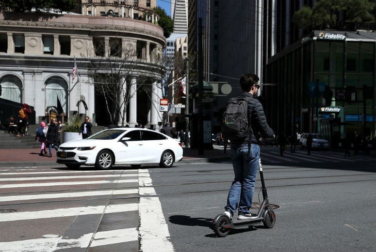 SAN FRANCISCO, CA - APRIL 17: A user rides a Bird scooter on April 17, 2018 in San Francisco, California.