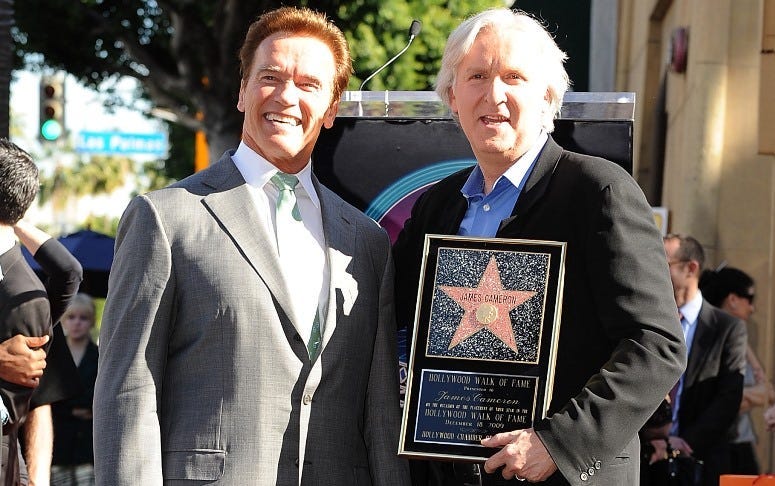 Arnold Schwarzenegger poses with Director James Cameron who was honored on The Hollywood Walk Of Fame with his own star on December 18, 2009 in Hollywood, California