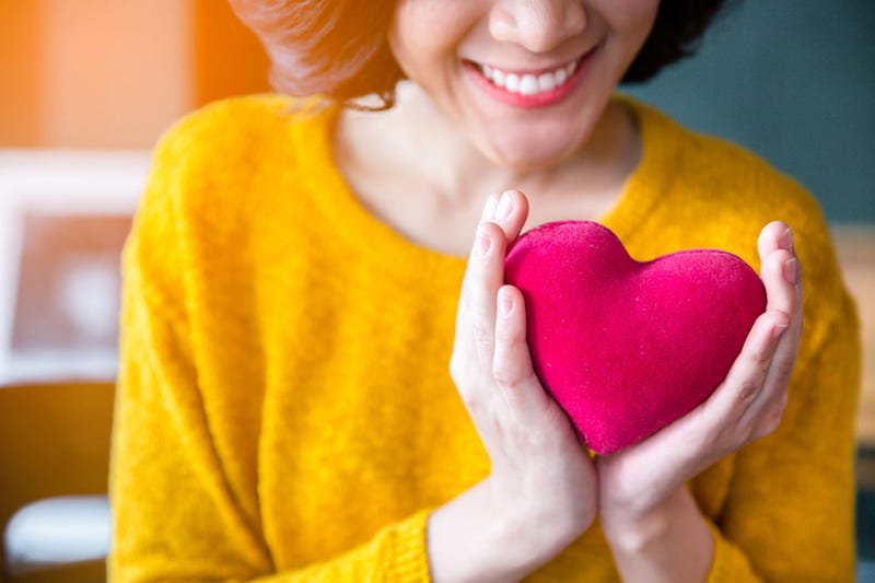Woman Holding a heart
