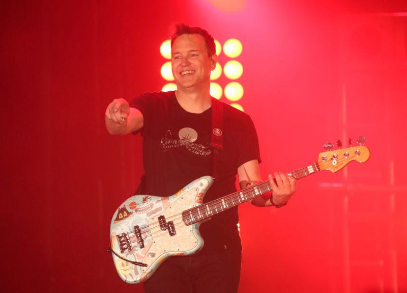Mark Hoppus points at crowd