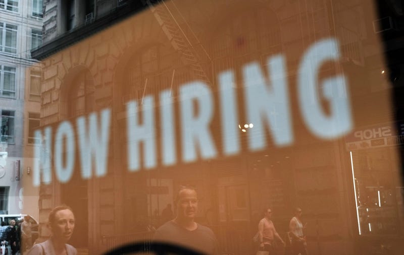 A store advertises that they are hiring 