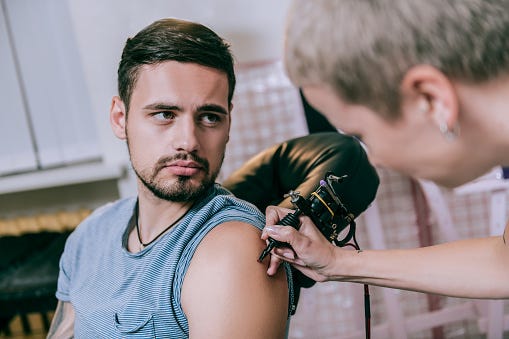 Man Getting A Tattoo