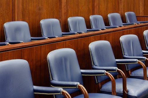 Empty jury seats in courtroom
