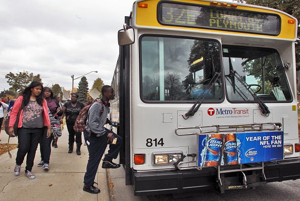 Students from Edison High School in Minneapolis board Metro Transit buses