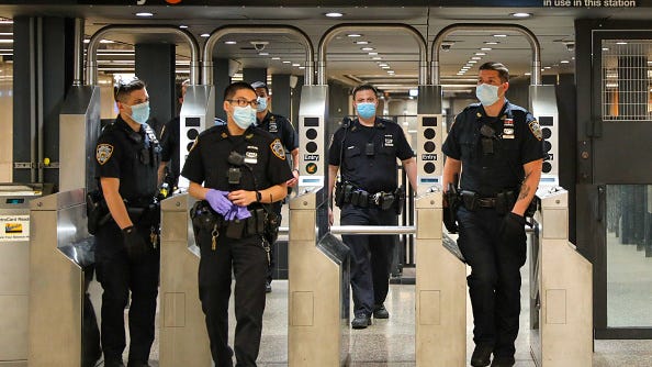 NYPD: Asian man pushed onto Queens subway tracks, suspect sought