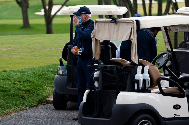 US President Joe Biden leaves his cart after a round of golf at Wilmington Country Club in Wilmington, Delaware, on April 17, 2021. - President Joe Biden played golf for the first time in his presidency Saturday, hitting the fairways in his home city of Wilmington