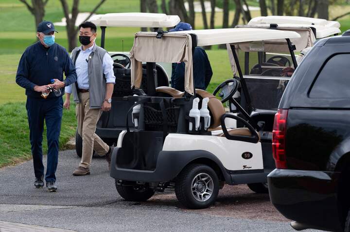 US President Joe Biden leaves his cart after a round of golf at Wilmington Country Club in Wilmington, Delaware, on April 17, 2021. - President Joe Biden played golf for the first time in his presidency Saturday, hitting the fairways in his home city of Wilmington