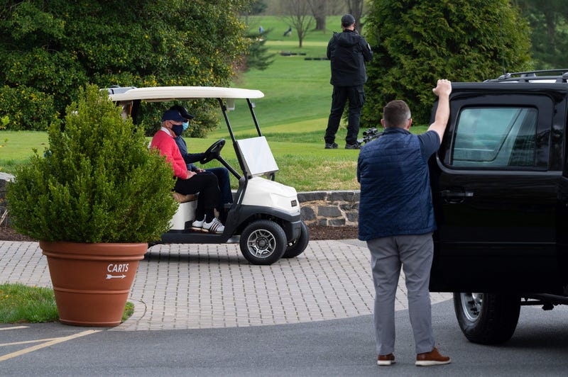 US President Joe Biden drives his cart after a round of golf at Wilmington Country Club in Wilmington, Delaware on April 17, 2021. - President Joe Biden played golf for the first time in his presidency Saturday, hitting the fairways in his home city of Wilmington