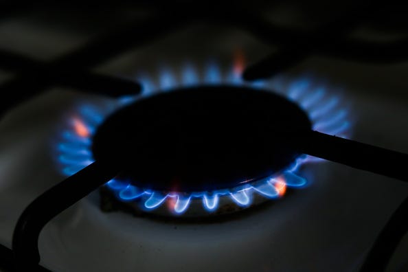 Gas stove lets off a blue flame