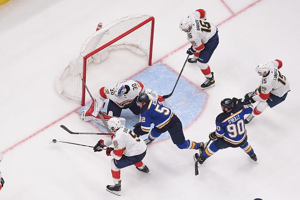 The Florida Panthers defend the net against Noel Acciari #52 and Ryan O'Reilly #90 of the St. Louis Blues at the Enterprise Center on February 14, 2023 in St. Louis, Missouri.