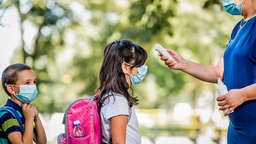 Kansas governor recommends masks for all in K-12 schools