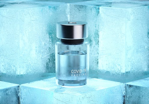 Covid-19 vaccine bottles on ice cubes