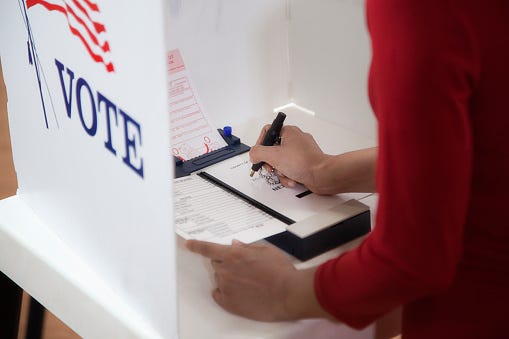 Voter attempting to write-in a name on a ballot