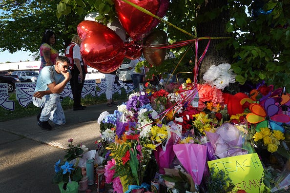 A makeshift memorial outside of Tops Market on Jefferson Avenue in Buffalo. A gunman opened fire at the store Saturday killing ten people and wounding another three