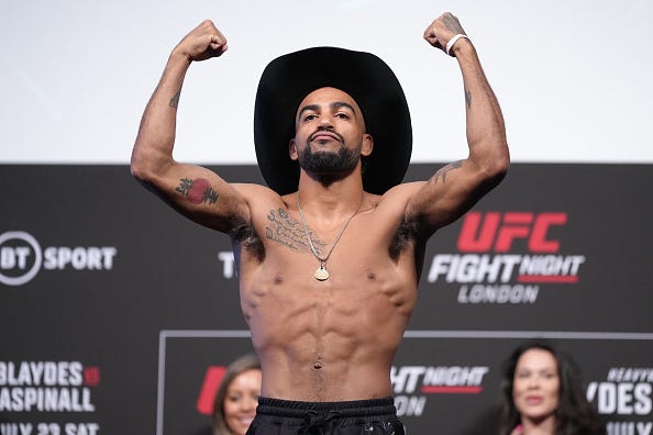 Charles Johnson poses on the scale during the UFC Fight Night ceremonial weigh-in