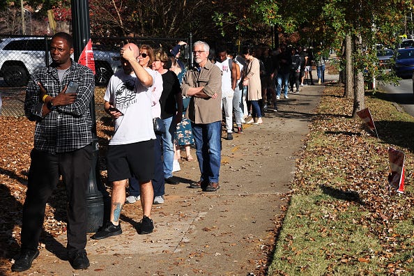 People wait in line for early voting in Buffalo and across the country