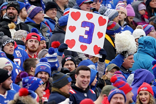A Buffalo Bills fan holds a sign in support of Buffalo Bills safety Damar Hamlin during a game against the New England Patriots at Highmark Stadium on January 08, 2023 in Orchard Park, New York