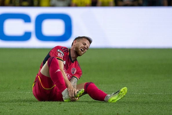 COLUMBUS, OH - JULY 23: Rasmus Alm #21 of St. Louis City holds his foot while sitting on the ground during the second half of the Leagues Cup group stage match against the Columbus Crew at Lower.com Field in Columbus, Ohio on July 23, 2023.