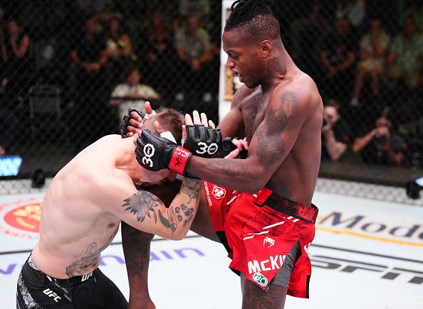 LAS VEGAS, NEVADA - OCTOBER 14: (R-L) Terrance McKinney lands a knee against Brendon Marotte in a lightweight fight during the UFC Fight Night event at UFC APEX on October 14, 2023 in Las Vegas, Nevada.