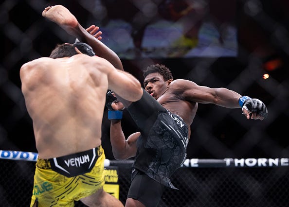 - MARCH 30: Joaquin Buckley kicks Vicente Luque