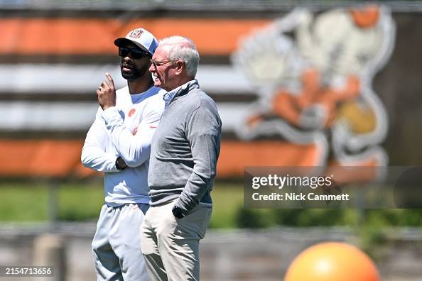 Executive Vice President, football operations & general manager Andrew Berry of the Cleveland Browns talks with managing and principal partner Jimmy Haslam during an OTA offseason workout at their CrossCountry Mortgage Campus on May 30, 2024 in Berea, Ohio.